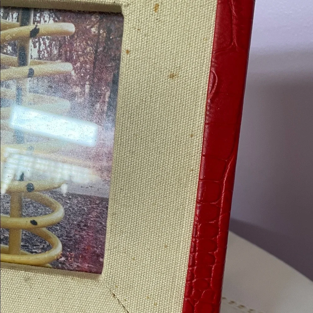 Red  leather trim picture frame holds 5x7